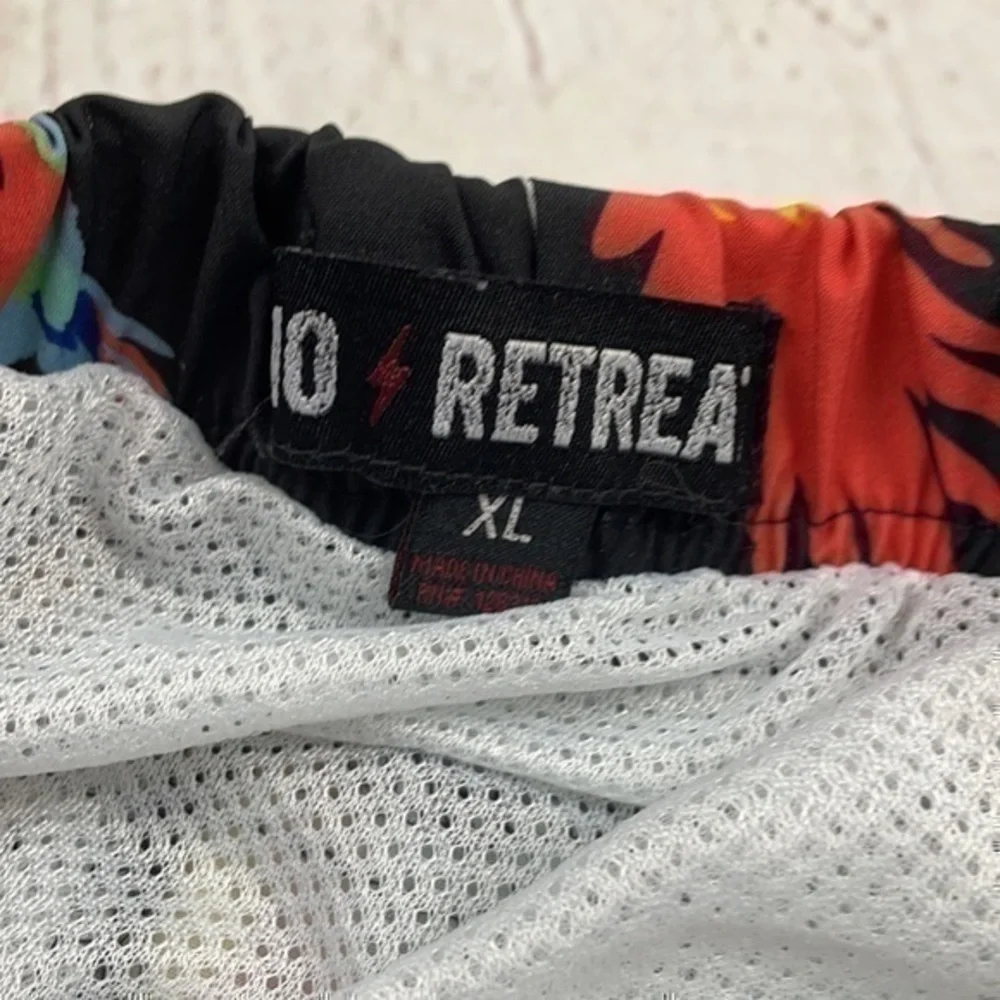 UEC men’s XL parrot swim trunks by No Retreat